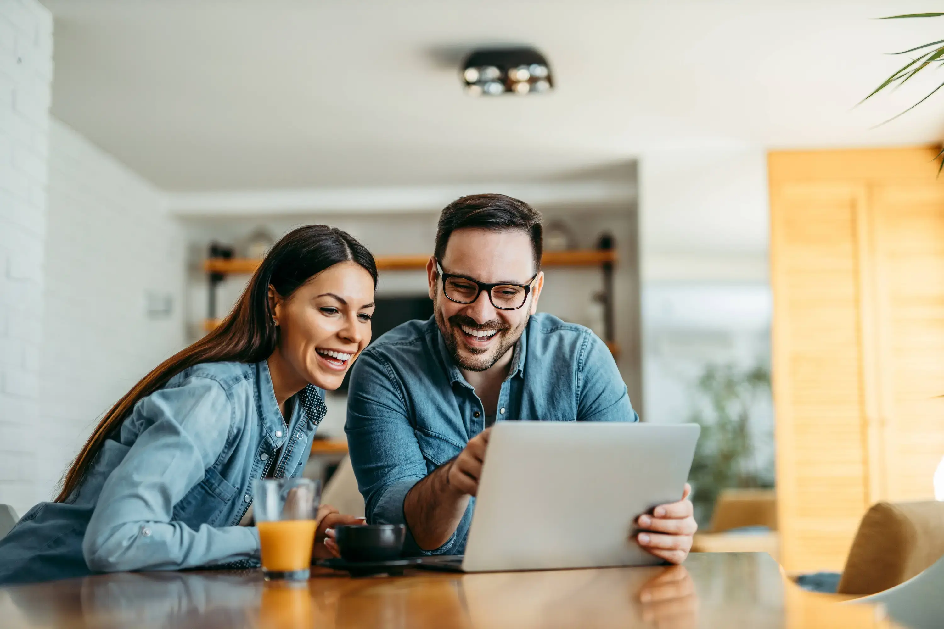 Couple looking at laptop